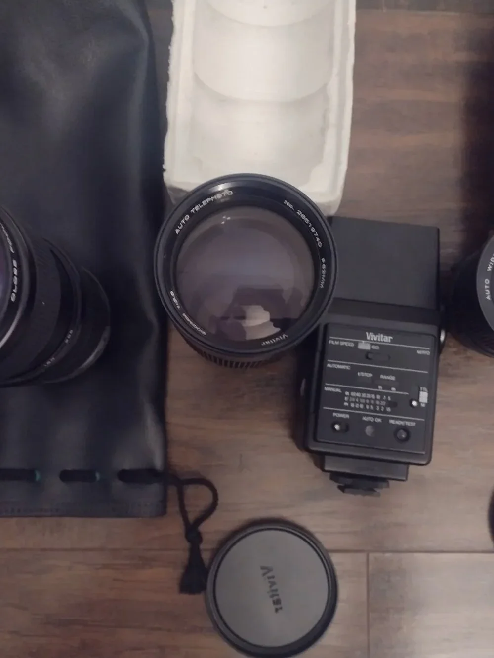 Lot of 4 Vivitar camera lenses, flash, leather bags